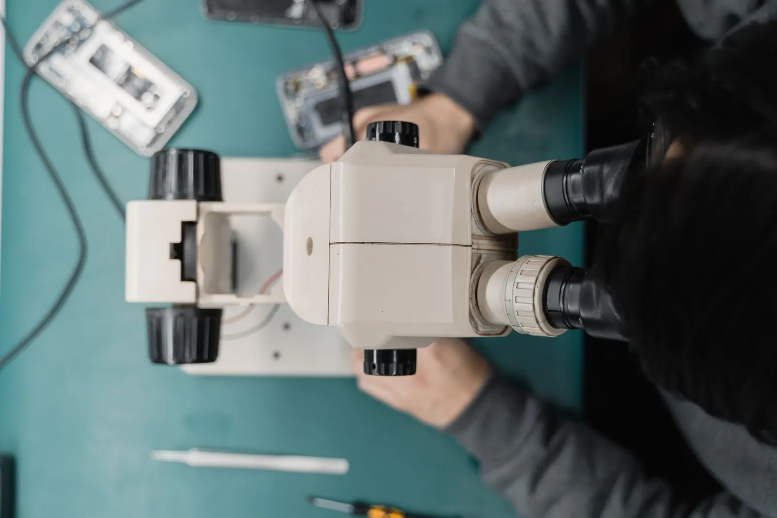 Chip-level phone repair under a microscope