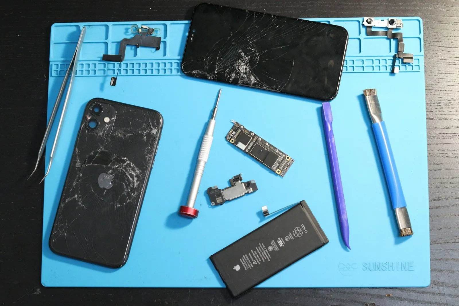 Disassembled iPhone with repair tools, Prince Mobile Service Center Kota
