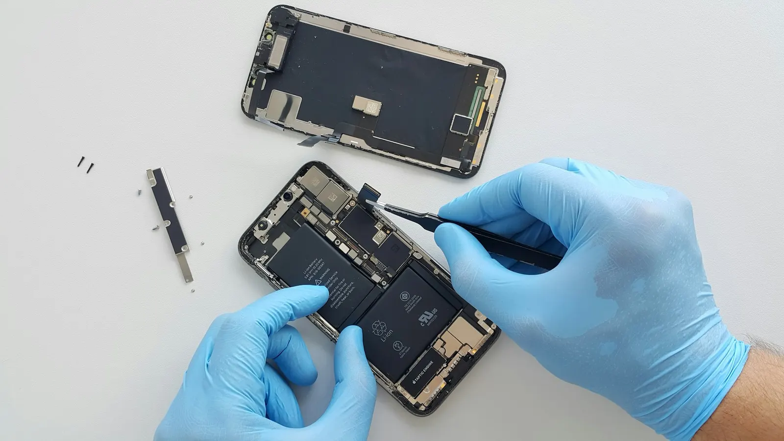 Technician repairing a smartphone, Prince Mobile Service Center Kota
